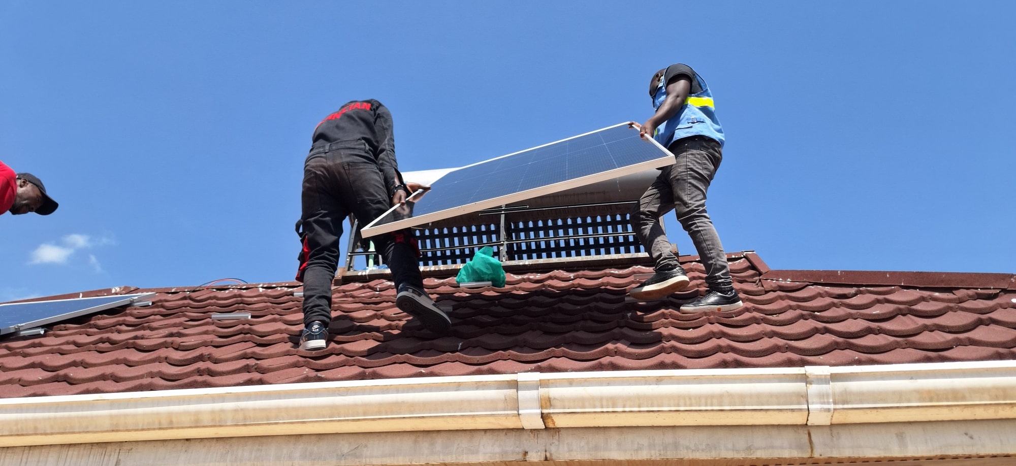 Solar technicians at work installing solar panels for 10kW solar system